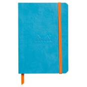 Blaues Notizbuch mit orangefarbener Gummiband. Das Logo 'Rhodia' ist auf der Vorderseite eingeprägt.