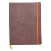 Braunes Notizbuch mit orangefarbener Gummibandbindung. Das Logo 'Rhodia' ist auf der Vorderseite eingeprägt.