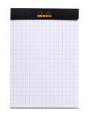 Notizblock mit kariertem Papier. Oben schwarzer Rand mit orangefarbener Aufschrift 'Rhodia'.
