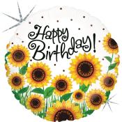 Runde Luftballon mit dem Aufdruck 'Happy Birthday'. Umgeben von gelben Sonnenblumen.