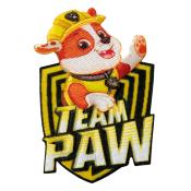 Aufnäher mit einem cartoonhaften Hund. Hund trägt gelbe Uniform und Mütze. Hintergrund in Form eines Wappens mit dem Text 'TEAM PAW' in Gelb.