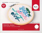 Stickset mit bunten Pflanzenmotiven. Im Stickrahmen, auf hellem Stoff.