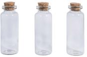 Drei transparente Glasflaschen mit Korkverschluss. Flaschen sind gleich groß und zylindrisch.