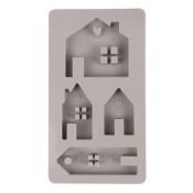 Silikonform mit verschiedenen Hausformen und einem Anhänger. Die Formen haben kleine Details wie Herzen und Fenster.