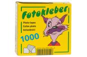 Gelbe Verpackung mit einem cartoonhaften Tier, das zwinkert. Aufschrift: 'Fotokleber', 'Photo-tapes', '1000'.