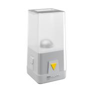 Kompakte LED-Lampe in transparentem Gehäuse. Mit gelbem Knopf und markantem Design.