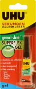 Kleber in einer kleinen Tube mit schwarzem Deckel. Verpackung in Gelb und Rot, mit Hinweisen zu Anwendung und Eigenschaften.