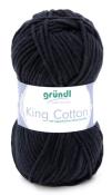 Dunkelblaues Garn in einem runden Knäuel. Beschriftung mit 'King Cotton' und Hinweis auf ägyptische Baumwolle.