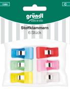 Sechs bunte Stoffklammern in verschiedenen Farben. Verpackt in einer transparenten Tüte.