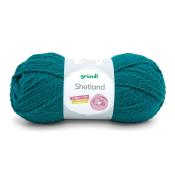 Garnknäuel in türkisfarbener Farbe. Verpackung zeigt den Namen Shetland und Hinweise zur Nutzung.