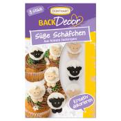 Verpackung mit 8 süßen Schaf-Dekorationen aus Zucker. Die Schafe sind in verschiedenen Farben auf Cupcakes abgebildet.