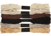 Sechs Bündel von Stickgarn in verschiedenen Farben. Farben sind beige, braun, schwarz und gold.