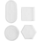 Vier weiße Platten in verschiedenen Formen: oval, rund, quadratisch und sechseckig. Alle Platten sind flach und ohne Muster.