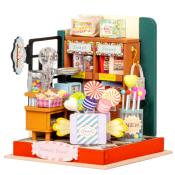 Miniatur eines Süßwarenladens mit bunten Süßigkeiten. Enthält Lutscher, Bonbons und eine Kasse.