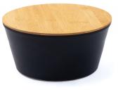 Runder Tisch mit schwarzem Unterteil und Holzplatte aus Bambus. Schlichtes, modernes Design.