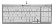Silberne Computer-Tastatur mit weißen Tasten. Enthält Ziffernblock und Funktionstasten.