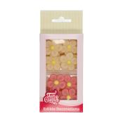 Verpackung mit essbaren Blumen-Dekorationen. Enthält gelbe und rosa Blüten.