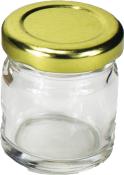 Kleines, rundes Glasgefäß mit goldenem Deckel. Transparentes Glas ohne Inhalt.
