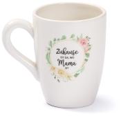 Weiße Tasse mit floralem Design. Aufdruck: 'Zuhause ist da, wo Mama ist'.