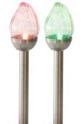 Zwei dekorative Lampen mit bunten Glasköpfen. Eine Lampe leuchtet rot, die andere grün.