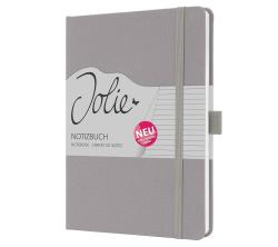 Graues Notizbuch mit elastischem Verschluss. Auf dem Cover steht 'Jolie Notizbuch' und ein Aufkleber mit 'NEU'.