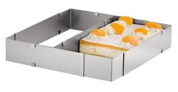 Eckige Kuchenform aus Edelstahl. Enthält einen Kuchen mit Sahne und Mandarinen.