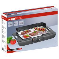 Elektrischer Tischgrill mit zwei Steaks und Gemüse. Grillfläche mit Metallrost und Temperaturregler.
