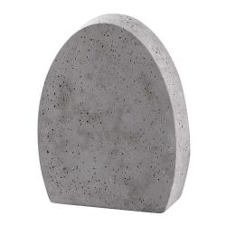 Grauer Betonblock in ovaler Form. Oberfläche mit kleinen Löchern.