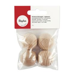 Vier rohe Holzhalbkugeln in einer transparenten Verpackung. Die Kugeln sind unbohrt und haben eine natürliche Holzoberfläche.