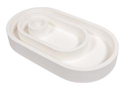 Silikonform für einen ovalen Kerzenständer. Enthält eine Kerze und eine kleine Hausform.