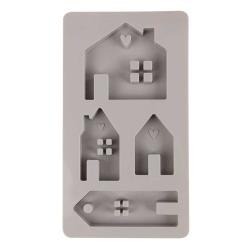 Silikonform mit verschiedenen Hausformen und einem Anhänger. Die Formen haben kleine Details wie Herzen und Fenster.