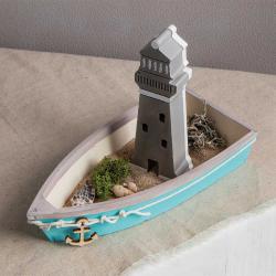 Silikonform mit drei Leuchtturm-Designs. Die Form ist grau und hat verschiedene Details.