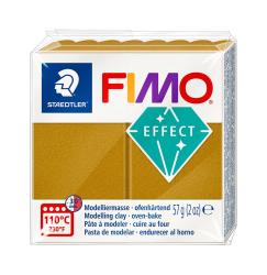 Fimo Modelliermasse in goldener Farbe. Verpackung mit Informationen zur Anwendung.