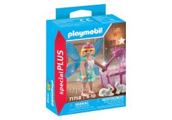 Spielzeugverpackung von Playmobil mit einer Fee. Die Fee hat Flügel und einen Zauberstab, umgeben von zwei kleinen Hasen.