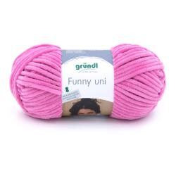 Rosa Wolle in einem runden Knäuel. Die Oberfläche ist weich und plüschig.