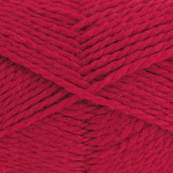 Rotes Wollknäuel mit der Aufschrift 'Shetland'. Verpackt mit einem Etikett von der Marke grünDl.