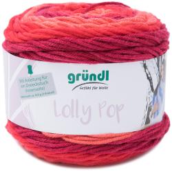 Wollknäuel in warmen Farbtönen von Rosa bis Rot. Verpackung mit Anleitung für ein Dreieckstuch.