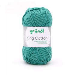 Grüner Baumwollgarn in einem Knäuel. Beschriftung mit dem Namen 'King Cotton'.