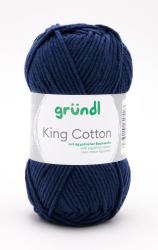 Dunkelblaues Baumwollgarn in einem runden Knäuel. Auf dem Etikett steht 'King Cotton' mit Informationen zur Herkunft.