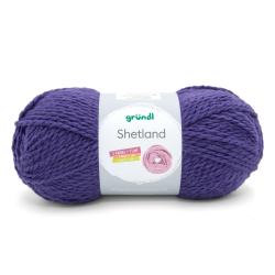 Lila Wollknäuel mit der Aufschrift 'Shetland'. Verpackung zeigt zwei Knäuel und einen Loop.