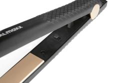 Haarglätter in Schwarz mit goldenen Platten. Ergonomischer Griff und Kabelanschluss.