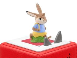 Figur eines Hasen in blauer Kleidung. Dazu ein Buch mit dem Titel 'DIE neue Häsenschule'.