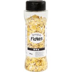Bunte Farbsplitter in Gelb, Weiß und Braun. Unregelmäßige Formen und Größen.