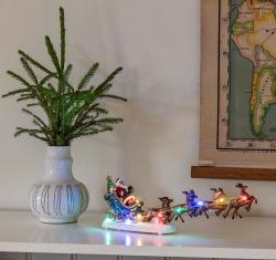 LED-Szenerie Weihnachtsmann auf Schlitten 35,5 × 14 × 6,5 cm bunt