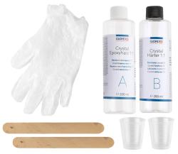 Verpackung für Crystal Epoxyharz 1:1. Enthält verschiedene transparente und farbige Epoxy-Objekte.