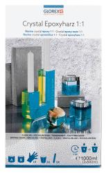 Verpackung für Crystal Epoxyharz 1:1. Zwei transparente Behälter, eine Kerze, eine Glaskugel. Farben: Blau, Gelb, Silber. Hochglänzende Oberfläche.