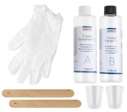 Verpackung für Crystal Epoxyharz 1:1. Zwei transparente Behälter, eine Kerze, eine Glaskugel. Farben: Blau, Gelb, Silber. Hochglänzende Oberfläche.