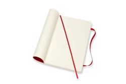 Ein offenes Notizbuch mit cremefarbenen Seiten. Ein rotes Lesezeichen ist sichtbar.