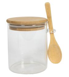 Glasbehälter mit einem Holzdeckel und einem kleinen Holzlöffel. Der Behälter ist transparent und hat eine runde Form.