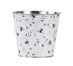 Metallischer Blumentopf mit buntem Blumen- und Bienenmuster. Weißer Hintergrund.